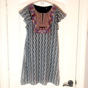 This is a black and white embroidered yoke Aztec print dress